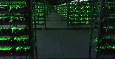 A well-organized Mining farm with rows of mining rigs.